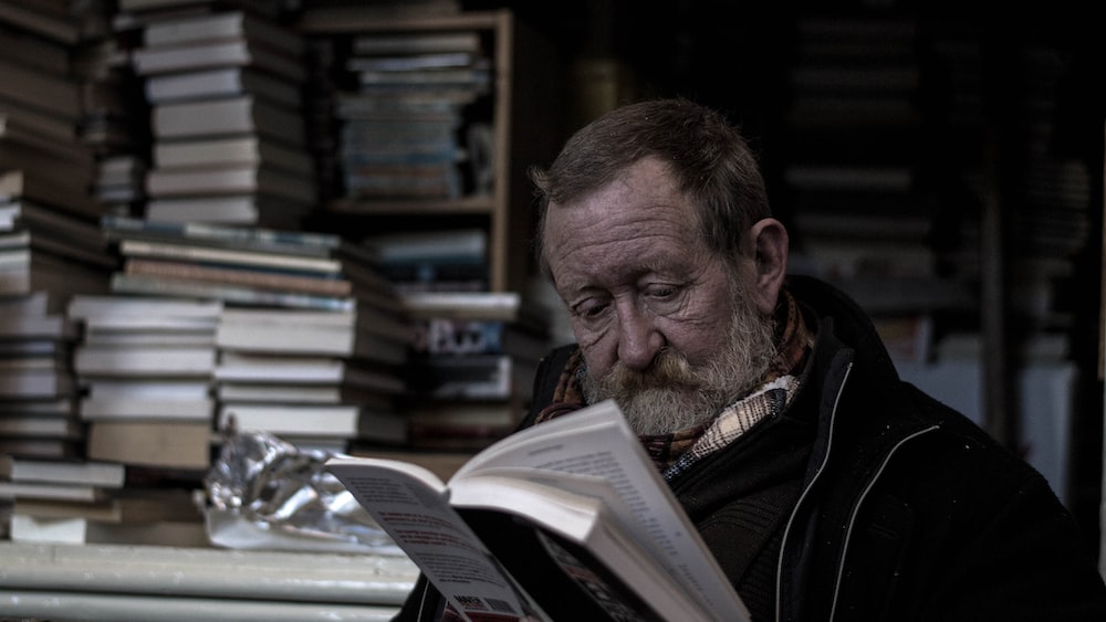 Optimizing Reading Speed: A Man Engaged in Books